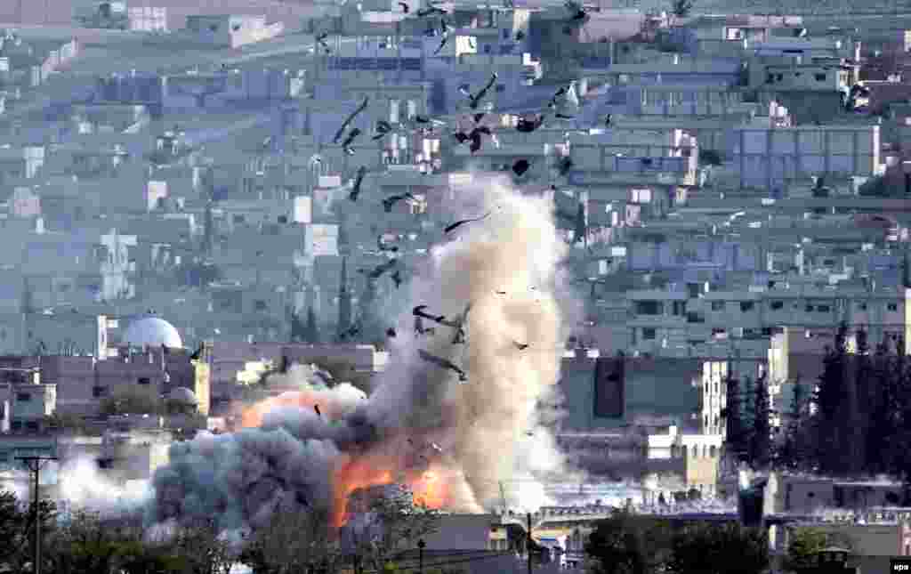 An explosion erupts after an apparent U.S.-led coalition air strike on Kobani, Syria, as seen from the Turkish side of the border on October 27. (epa/Erdem Sahin) 