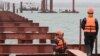 'Like Being A Slave': Workers On Russia's Bridge To Crimea Report Abuse, Deceit