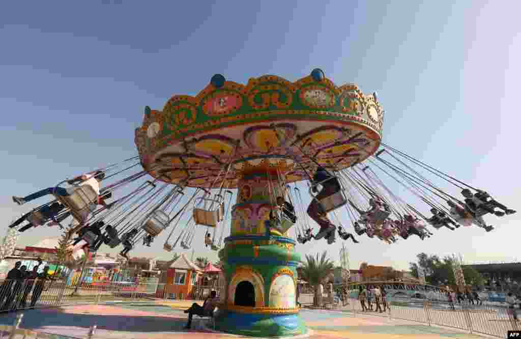 One of many attractions at a theme park during the Muslim holiday of Eid al-Adha in Baghdad (AFP/Ahmad Al-Rubaye)