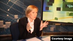 Tomsk--RFE/RL contributor Melanie Bachina reporting for Tomsk TV-2. Russia, undated.