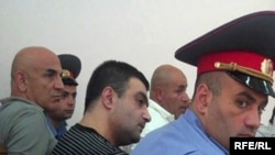 Armenia -- Gagik Matevosian (C) and other men accused of plotting to assassinate State Revenue Committee chief Gagik Khachatrian at the start of their trial, 8July 2010.