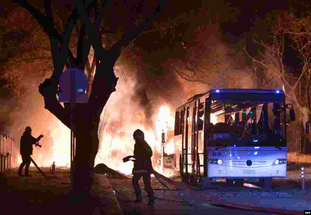 Firefighters try to extinguish the flames at the scene of a bomb blast in Ankara, Turkey, on February 17 that killed at least 28 people. (epa)