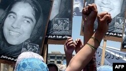 Afghan women take part in a demonstration against the national parliament's removal of outspoken female legislator Malalai Joya in May 2007.