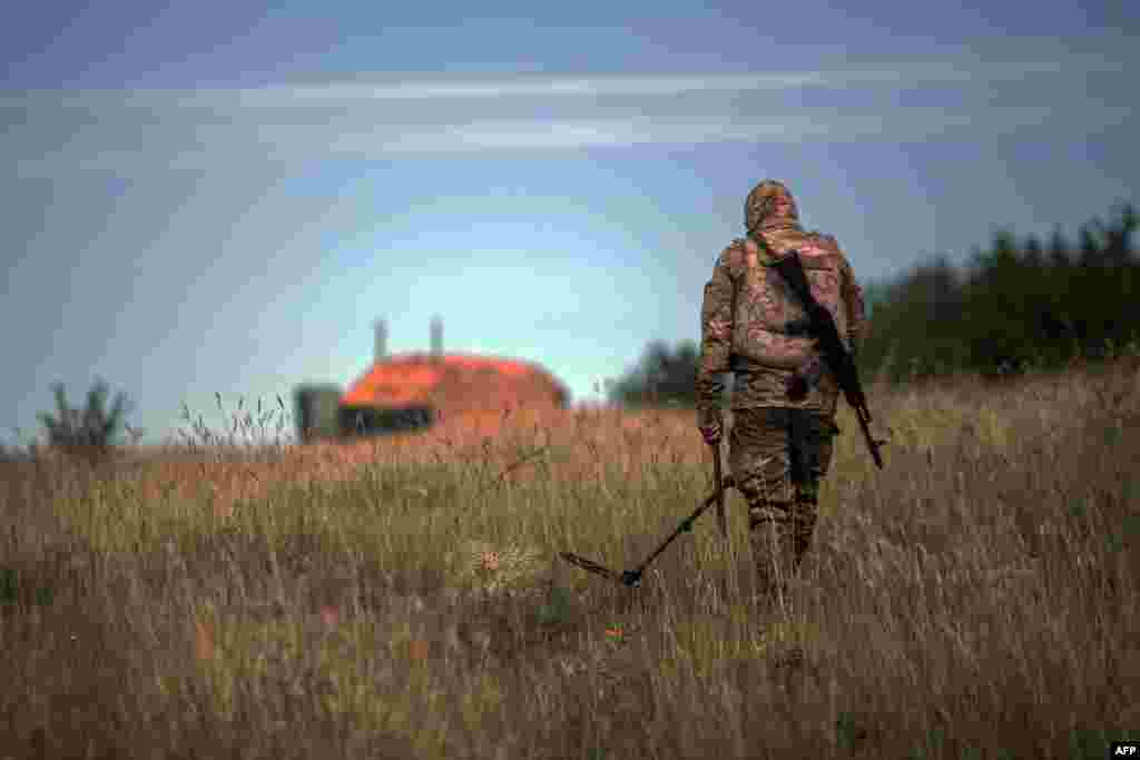 A Ukrainian serviceman checks for mines along the positions of Ukrainian forces near Seversk in the eastern Donetsk region. (AFP/Oleksandr Ratushniak)