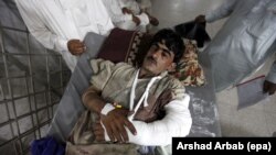 A man who was injured in twin bomb blasts in Parachinar in the Kurram tribal agency is brought to a hospital on June 24. The Kurram region has been the scene of several deadly militant attacks against its Shi’ite population in recent years.