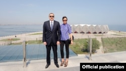 Azerbaijani President Ilham Aliyev and his wife, Mehriban, attend the opening of Baku's Crystal Hall, the venue of the Eurovision-2012 Song Contest and built by a construction company connected to the family through proxies.