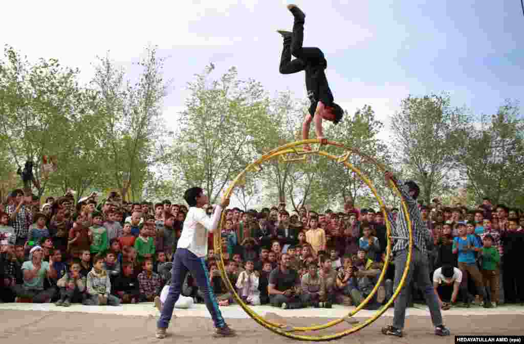AFGHANISTAN - An Afghan boy performs in a competition during the Afghanistan National Juggling Championship in Kabul, Afghanistan, 17 April 2015