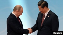 Президент Росії Володимир Путін і його китайський колега Сі Цзіньпін, Шанхай, 21 травня 2014 року