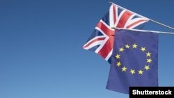 Generic – European Union and British Union Jack flag flying in front of bright blue sky in preparation for the Brexit EU referendum