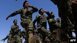 Afghan National Army officers march during a graduation ceremony at a training center in Herat in June. Afghan troops are increasingly taking control over security ahead of the planned withdrawal of foreign forces by the end of 2014.