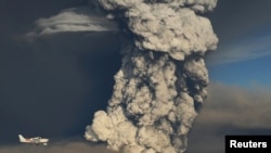 IA plane flies past a smoke plume from the eruption of the Grimsvotn volcano in Iceland on May 21.