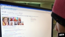A Chinese user checks information about the Dalai Lama - one of Beijing's censored subjects - on the Internet. 