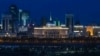 The Akorda (in the center of the photo with a blue dome and golden spire), the official residence of the president, stands out at night amid Astana's skyline.