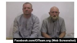 Григорий Цуркану (слева) и Роман Заболотний в плену у ИГИЛ