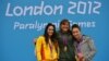 American bronze medalist Elizabeth Stone (right) joins Spanish silver medalist Sarai Gascon (left) and South African gold medalist Natalie du Toit on the podium after the women's 100-meter backstroke finals in London on August 31.