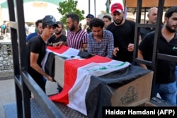 Похороны жертв столкновений с полицией в городе Ан-Наджаф. 4 октября 2019 года