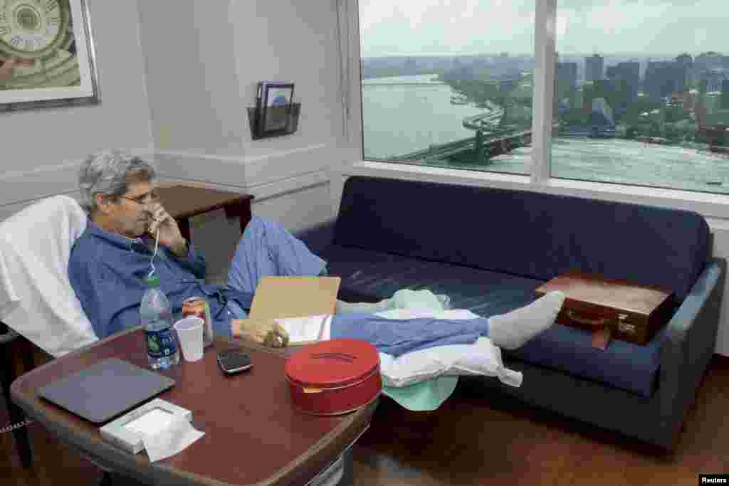 U.S. Secretary of State John Kerry speaks with National Security Adviser Susan Rice from his room at Massachusetts General Hospital in Boston on June 9. Kerry was receiving physical therapy after surgery on a broken right leg sustained in a cycling accident in France. (Reuters/State Department)