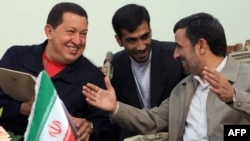 Iranian President Mahmud Ahmadinejad (right) meets with his Venezuelan counterpart, Hugo Chavez, in Tehran in October 2010.