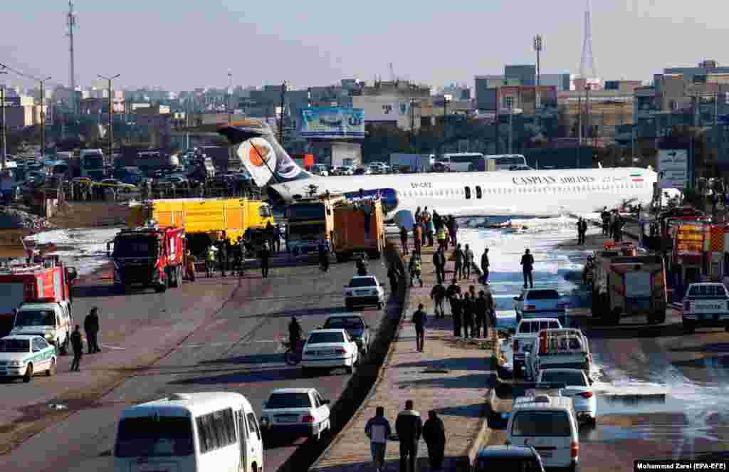 An Iranian passenger plane sits on a highway close to the airport in the southwestern Iranian city of Mahshahr after skidding off the runway. (epa-EFE/Mohammad Zarei)&nbsp;