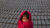 A Nepalese girl, whose parents are workers at a brick factory, in Bhaktapur on December 23. (Hemanta Shrestha/EPA) &nbsp;