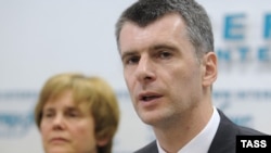 Mikhail Prokhorov (right) and his sister Irina hold a press conference in Moscow on June 4.