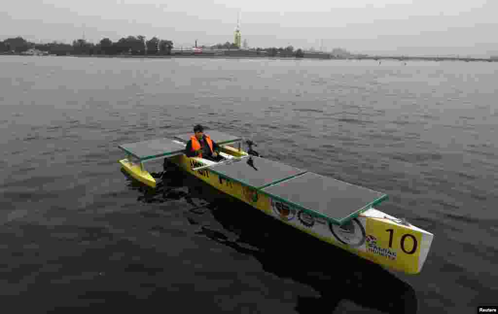 Russian designer Aleksei Maistro on board his electro-solar boat &quot;Amon Ra&quot;&nbsp;in St. Petersburg. The boat is expected to participate in an international competition of solar boats in 2015 in the Russian city.&nbsp;(Reuters/Aleksandr Demianchuk) 