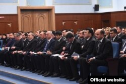 Tajik judges attend a meeting with the country’s president in February 2020.