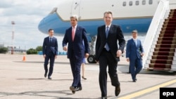 U.S. Secretary of State John Kerry walks with U.S. Ambassador to Ukraine Geoffrey Pyatt (front right) at Boryspil International Airport in Kyiv.