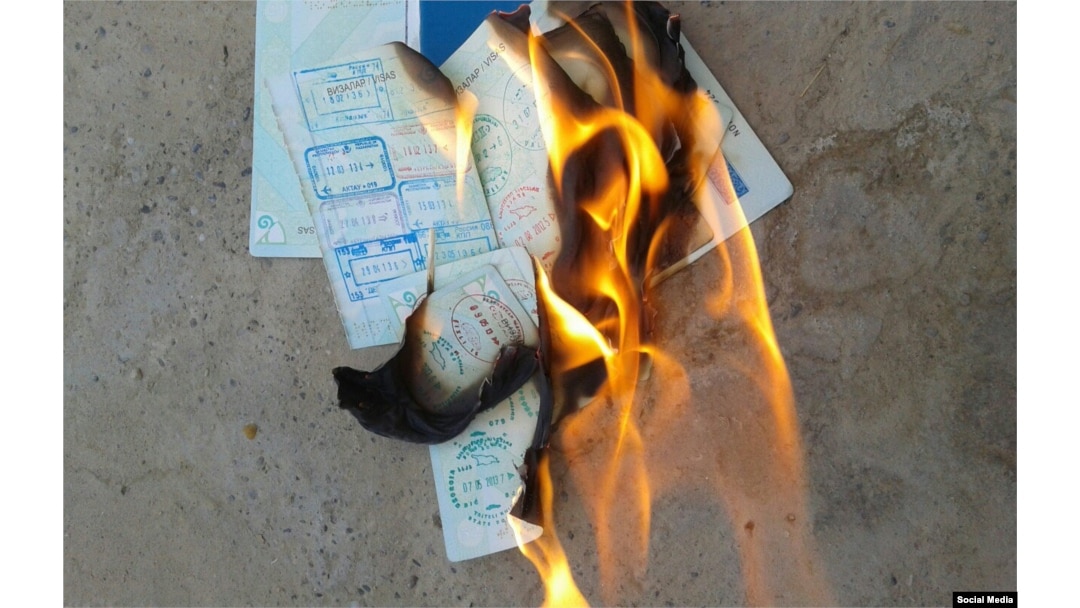 Artyom is shown first stepping on the passport and then burning it.