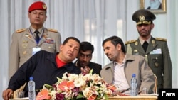 Iranian President Mahmud Ahmadinejad (right) welcomes his Venezuelan counterpart Hugo Chavez to Iran in October 2010.