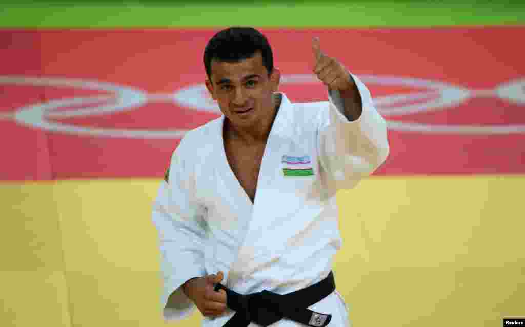 Rishod Sobirov of Uzbekistan celebrates winning a bronze medal in the men&acute;s 66-kilogram judo final.