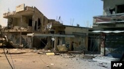 The aftermath of heavy shelling by Syrian government forces in the central city of Qusair earlier this year. (file photo)