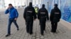 Security guards patrol near the Olympic Park ahead of the Sochi games next month. 