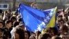 Croatia -- A girl waves a Bosnian flag in front of the prison uring the welcome ceremony for Bosnian Muslim Fikret Abdic in Pula, 09Mar2012