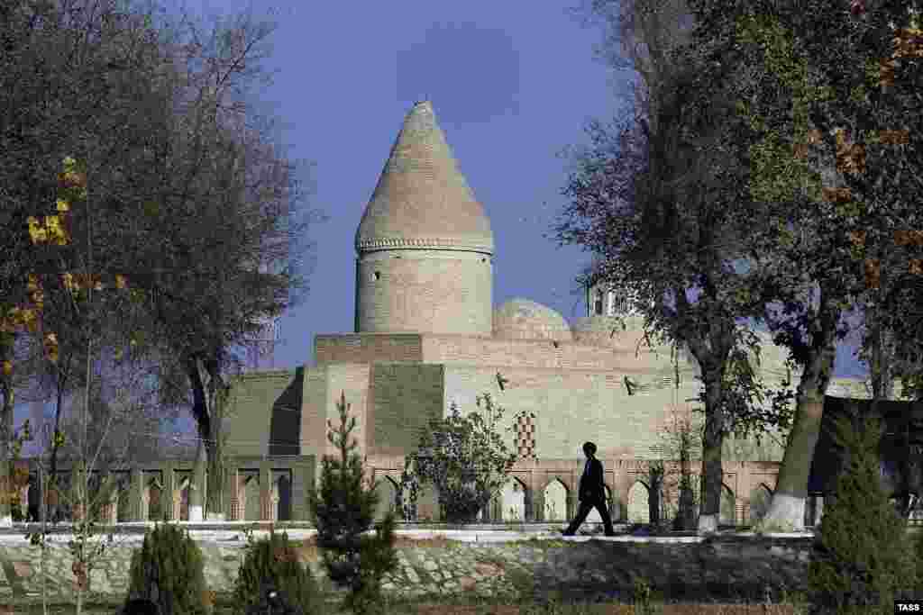 A man walks in the tranquility of Bukhara's Old City