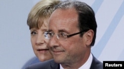 Германската канцеларка Ангела Меркел и новиот француски претседател Франсоа Оланд 