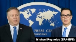 U.S. Secretary of State Mike Pompeo (left) and U.S. Treasury Secretary Steven Mnuchin announce sanctions against Iran during a news conference at the Foreign Press Center in Washington, November 5, 2018