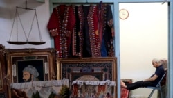 IRAN -- A carpet seller sits at his shop in the old main bazaar in Tehran, Iran, Sunday, June 23, 2019.