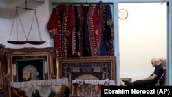 IRAN -- A carpet seller sits at his shop in the old main bazaar in Tehran, Iran, Sunday, June 23, 2019.
