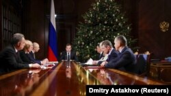 Russian Prime Minister Dmitry Medvedev chairs a meeting with his deputies at the Gorki state residence outside Moscow on December 23.