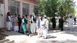 Relatives of Afghan citizens waiting to receive the bodies of their loved ones.