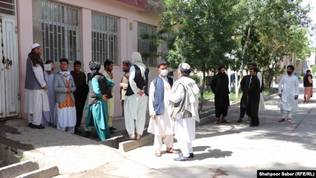 Relatives of Afghan citizens waiting to receive the bodies of their loved ones.
