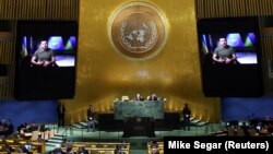 Ukrainian President Volodymyr Zelenskiy is pictured on video screens as he delivers a prerecorded address to the 77th Session of the United Nations General Assembly at UN Headquarters in New York on September 21.