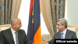 Armenian President Serzh Sarkissian meets PACE President Mevlut Cavusoglu in Yerevan on May 12.