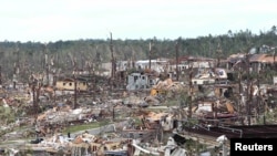 Tornadoes have torn through Alabama and other U.S. southern states, killing more than 300 people. This photo shows the devastation in Pratt City, a suburb of Birmingham, Alabama.