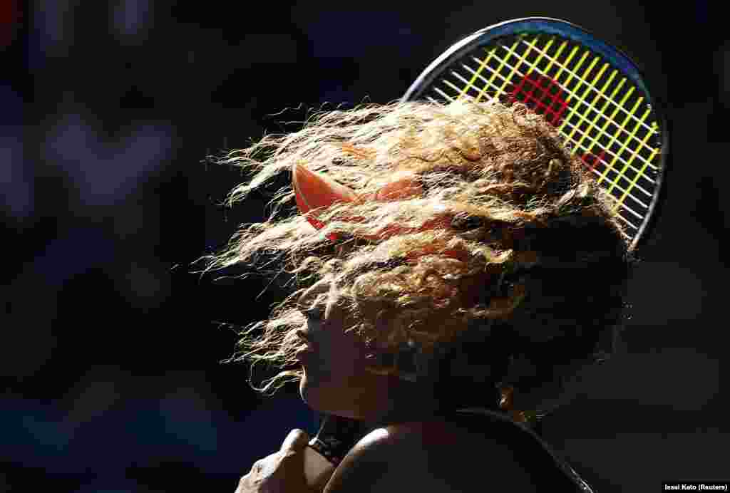 Tennis player Naomi Osaka of Japan in action against Simona Halep of Romania at the Australian Open in Melbourne on January 22. (Reuters/Issei Kato)