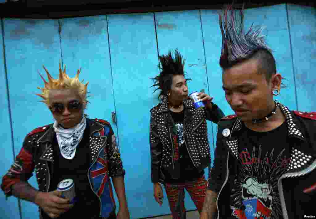 Youths dressed as punks drink beer as they wait for a punk music show during the Burmese New Year Water Festival in Rangoon. (Reuters/Soe Zeya Tun&nbsp;)