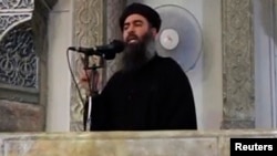 "Ислам мемлекеті" экстремистік тобының басшысы Әбу Бакр әл-Бағдади деп сипатталатын адамның фотосы.