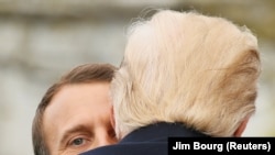 U.S. -- U.S. President Donald Trump and French President Emmanuel Macron hug during an arrival ceremony at the White House in Washington, U.S., April 24, 2018