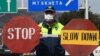 A Georgian policeman stands guard at a checkpoint in Tbilisi on April 1.